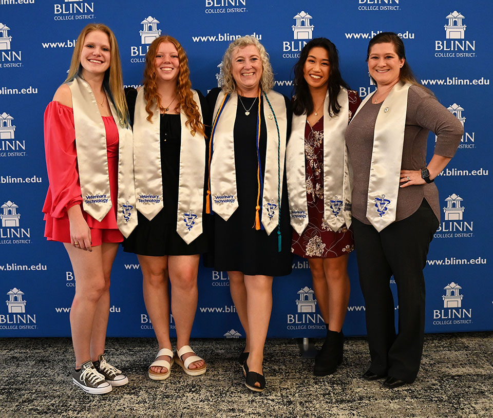 Five graduates are recognized in a ceremony at Texas A&M-RELLIS